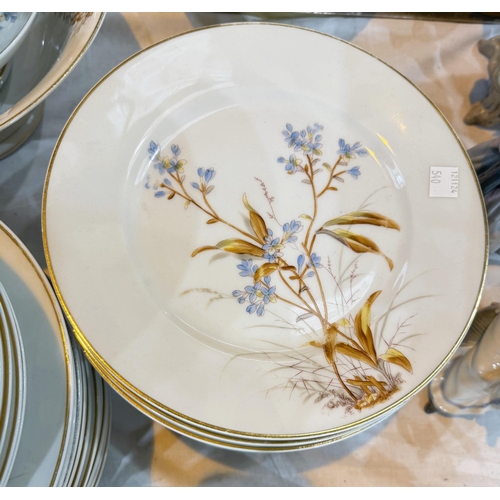 540 - A large Continental dinner service decorated in polychrome with flowering branches (approx. 70 piece... 