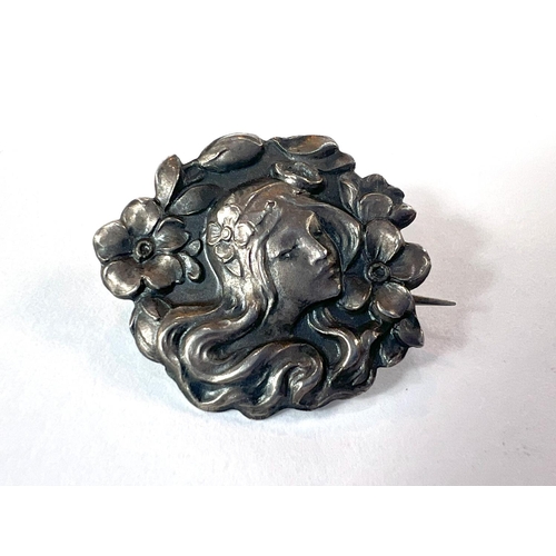 708 - A silver Art Nouveau brooch of female head in red leather box