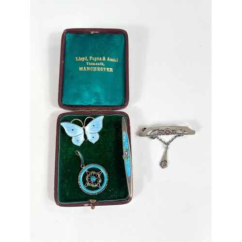 709 - A silver enamel ladies Secessionist brooch and other similar brooches