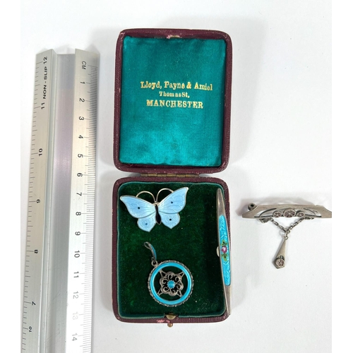 709 - A silver enamel ladies Secessionist brooch and other similar brooches