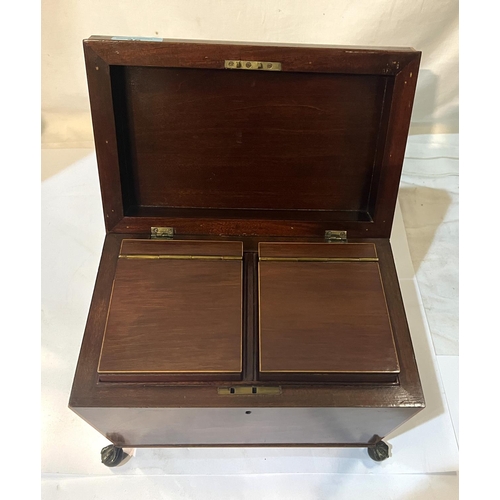 36 - A Sheraton period mahogany Sarcophagus-shaped tea caddy with boxwood banding; double fitted interior... 