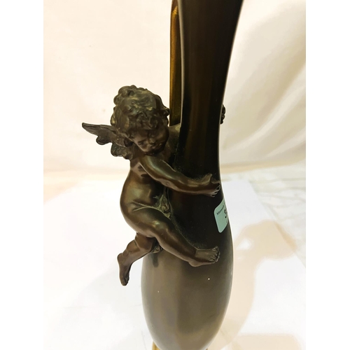 38 - A bronze elongated baluster base with cherub, height 40cm.