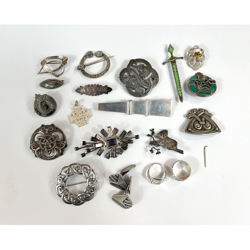 710 - A collection of silver Scandinavian and Celtic brooches etc