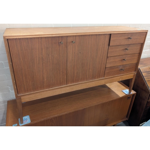 1002 - A mid 20th century dining suite, comprising sideboard, double cupboard and 4 drawers, extending teak... 