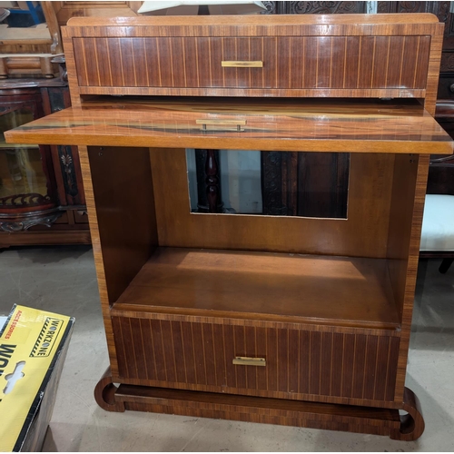 1011 - An Art Deco style inlaid converted drinks cabinet with up and over front door, drawers above and bel... 