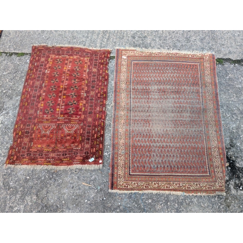 1013 - An early/mid 20th century Persian hand knotted prayer rug with 2 vertical rows of elephant foot moti... 