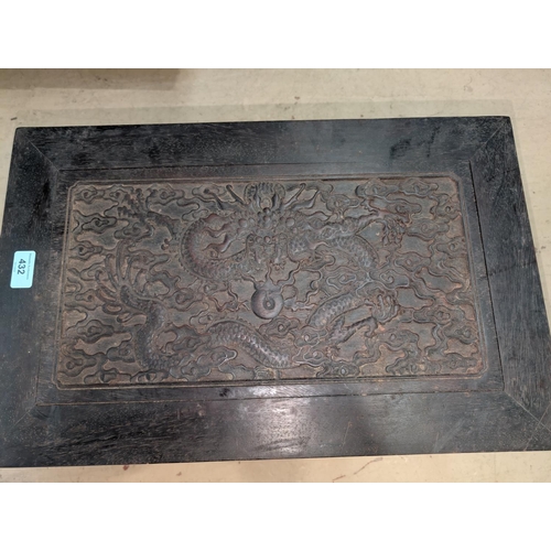 432 - A Chinese carved hardwood stand with dragon panel to the top. 55x34x23height.