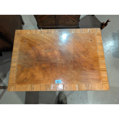 982 - A crossbanded mahogany occasional table with drawerNo bids sold with next lot