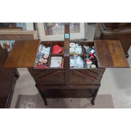 983 - A cantilevered oak sewing box