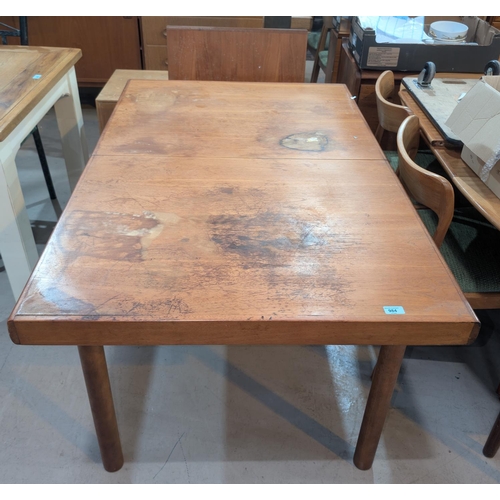 984 - A mid-20th Century teak extending dining table of rectangular form with extra leaf, length 137cm, le... 