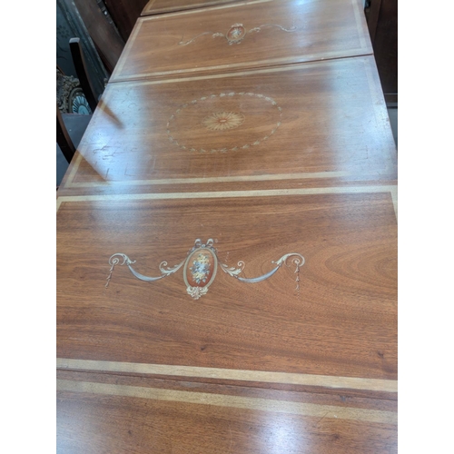 987 - A large late 19th/early 20th century mahogany Adams style painted dining table comprising two demi-l... 