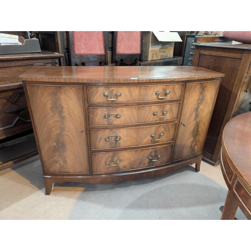 992 - A Reprodux for Bevan and Funnell Regency mahogany dining suite comprising circular pedestal table wi... 