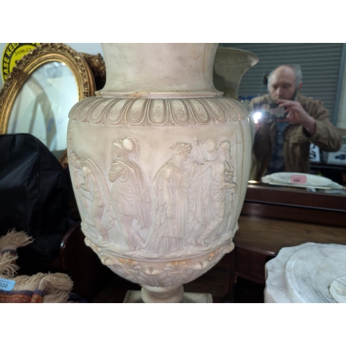 100 - A large and impressive carved Taurus marble vase on column and stand, with Graeco-Roman figures to t... 