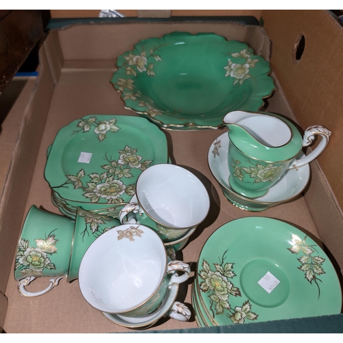 125 - A NORITAKE green enamelled porcelain tea service, another tea service (modest) and a pottery dinner ... 