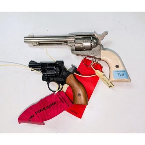 186 - A reproduction revolver and a reproduction Olympic 6