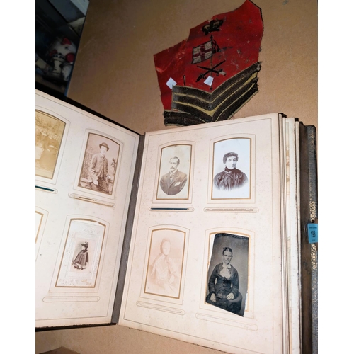 198 - A Victorian military photo album; 2 red cloth Sergeant stripes.