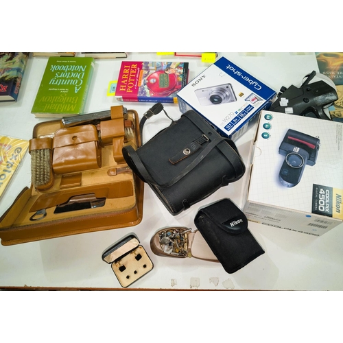 324A - A vintage gents overnight case, a selection of gents cuff links, A pair of binoculars, two boxed cam... 