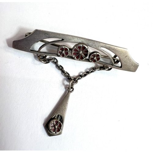 709 - A silver enamel ladies Secessionist brooch and other similar brooches