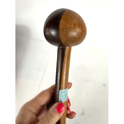 311 - A carved wooden two tone knobkerrie