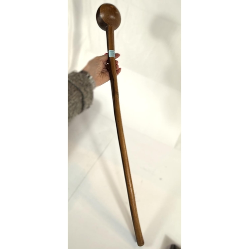 311 - A carved wooden two tone knobkerrie