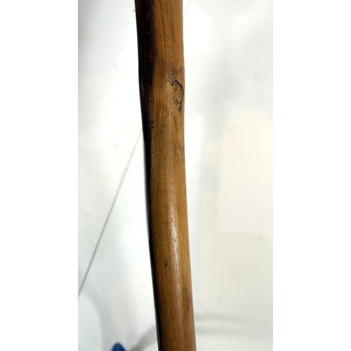 311 - A carved wooden two tone knobkerrie