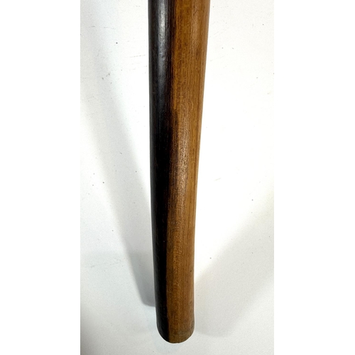 311 - A carved wooden two tone knobkerrie