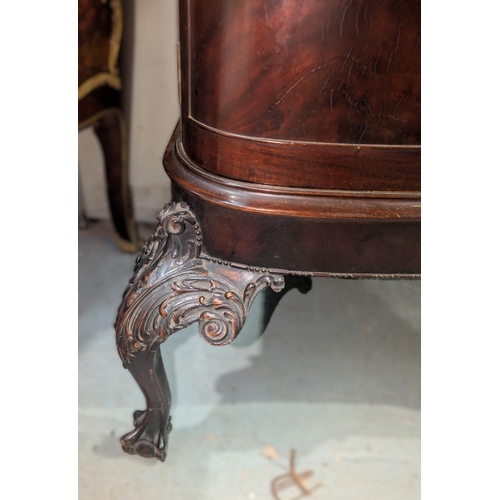 999 - An early 20th century mahogany reverse bow front period style display cabinet with carved cornice an... 