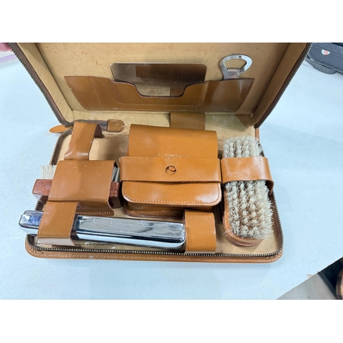 324A - A vintage gents overnight case, a selection of gents cuff links, A pair of binoculars, two boxed cam... 