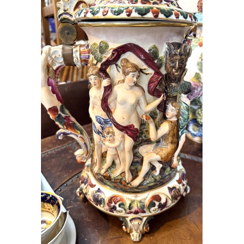 563 - A large ornamental Capodimonte stein with naked figures in polychrome and relief, ht. 53cm.