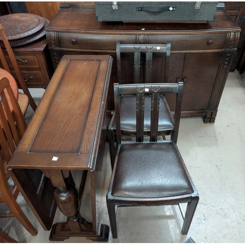 998 - An oak dining suite comprising drop-leaf dining table, sideboard and chairs.