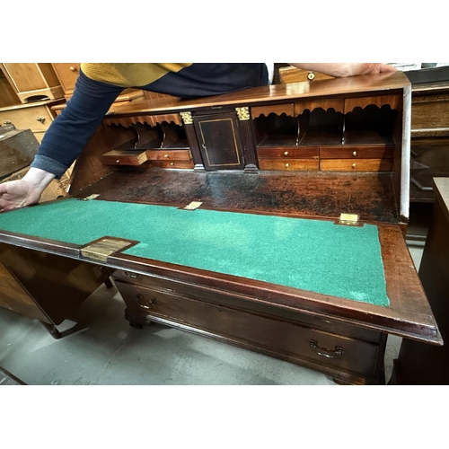 993 - A George III mahogany fall front bureau with fitted interior, 3 frieze and3 long drawers, on bracket... 