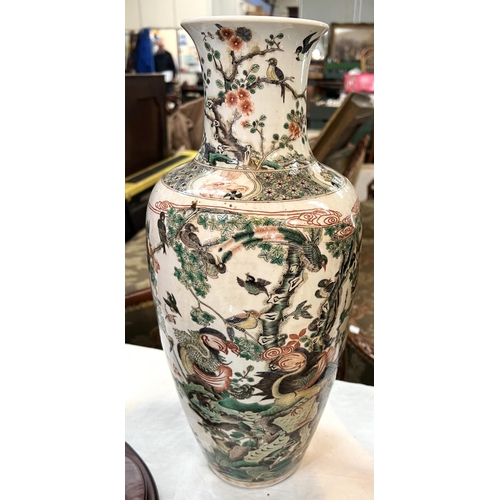 434B - A Chinese Famille Verte vase with polychrome decoration of birds on branches, height 44cm.