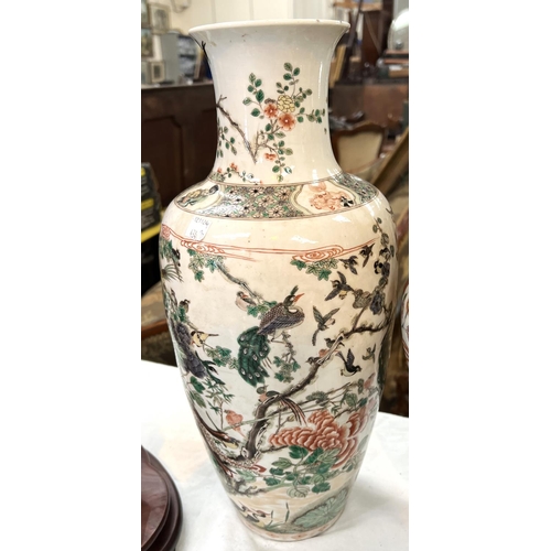 434B - A Chinese Famille Verte vase with polychrome decoration of birds on branches, height 44cm.