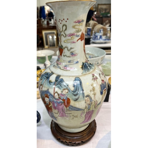 456 - A Chinese Famille Rose vase decorated with polychrome figures of people collecting flowers, with sea... 