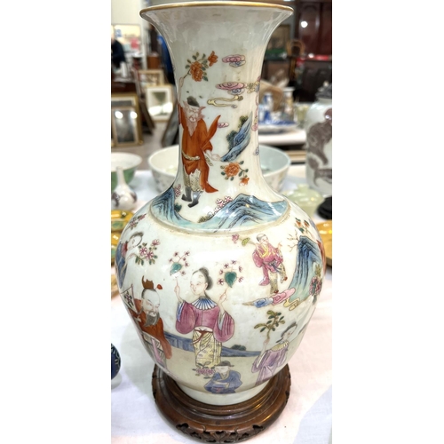 456 - A Chinese Famille Rose vase decorated with polychrome figures of people collecting flowers, with sea... 