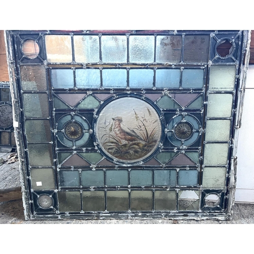 22 - Three stained glass leaded panels with central bird and coloured glass around, 1 = 68 x 92cm, 2 = 68... 