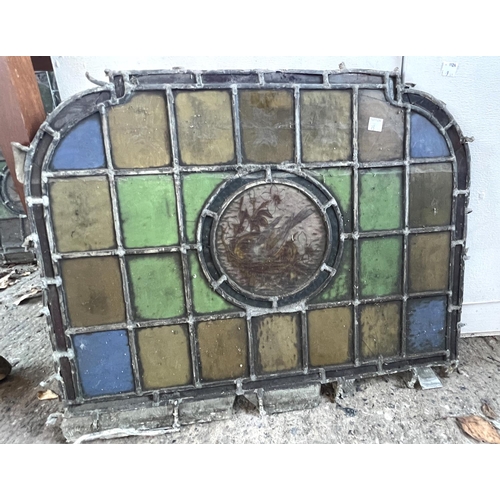 23 - Five leaded stained arch top glass panels with birds to the centre 44 x 56cm