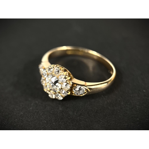 628 - A lady's yellow metal dress ring set with central old cut diamond,&nbsp; approx. 0.5ct surrounded by...