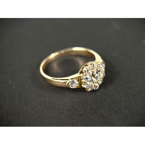 628 - A lady's yellow metal dress ring set with central old cut diamond,&nbsp; approx. 0.5ct surrounded by... 