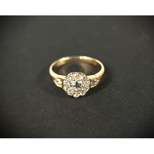628 - A lady's yellow metal dress ring set with central old cut diamond,&nbsp; approx. 0.5ct surrounded by... 