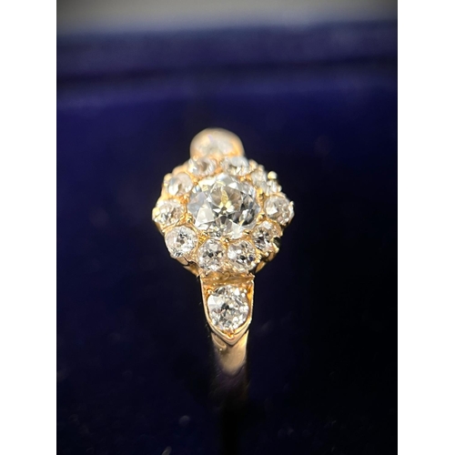 628 - A lady's yellow metal dress ring set with central old cut diamond,&nbsp; approx. 0.5ct surrounded by... 