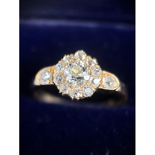 628 - A lady's yellow metal dress ring set with central old cut diamond,&nbsp; approx. 0.5ct surrounded by... 