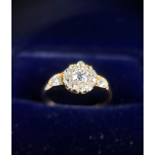 628 - A lady's yellow metal dress ring set with central old cut diamond,&nbsp; approx. 0.5ct surrounded by... 