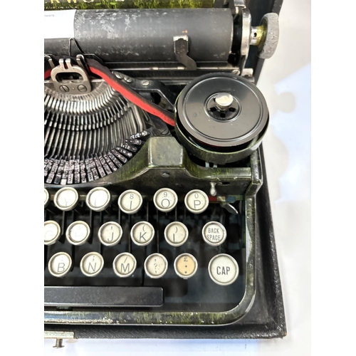 26 - A mid 20th century Underwood portable typewriter in box.