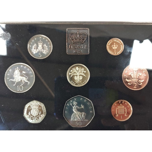 336 - A 2003 GB BU coin set, two 2006 Brunel &pound;2 coins in Royal Mint folder and a 1984 proof set.