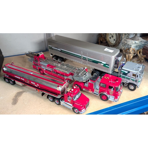 342 - Three large scale diecast vehicles, a fire engine, a tanker and a freighter.