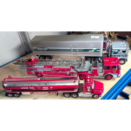 342 - Three large scale diecast vehicles, a fire engine, a tanker and a freighter.