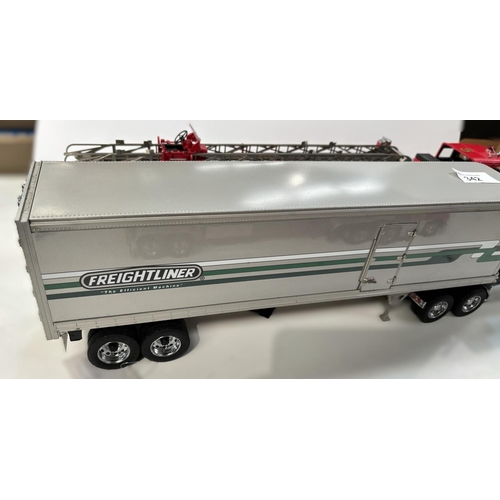 342 - Three large scale diecast vehicles, a fire engine, a tanker and a freighter.