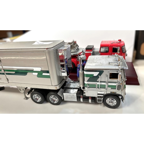 342 - Three large scale diecast vehicles, a fire engine, a tanker and a freighter.