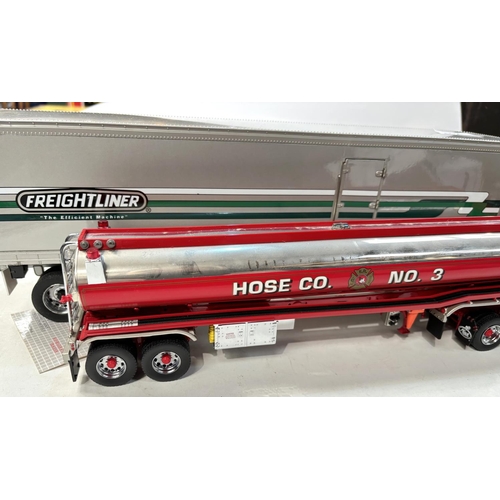 342 - Three large scale diecast vehicles, a fire engine, a tanker and a freighter.